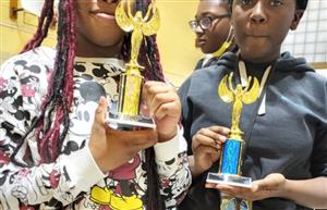 SWA students posing w/the trophies